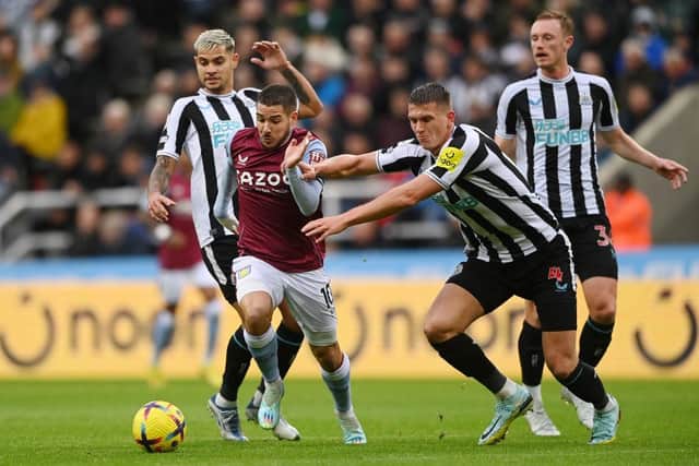 Emi Buendia of Aston Villa is challenged by Sven Botman of Newcastle United during the Premier League match between Newcastle United and Aston Villa at St. James Park on October 29, 2022 in Newcastle upon Tyne, England. (Photo by Stu Forster/Getty Images)