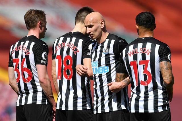 Jonjo Shelvey lines up a wall at Anfield.