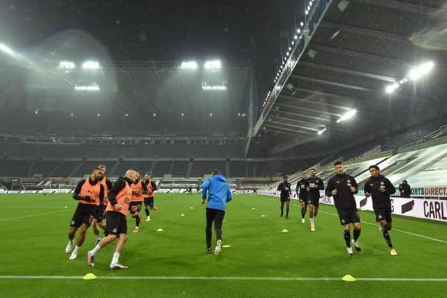 NEWCASTLE UPON TYNE, ENGLAND - OCTOBER 03: General view inside the stadium as the Newcastle United players warm up prior to the Premier League match between Newcastle United and Burnley at St. James Park on October 03, 2020 in Newcastle upon Tyne, England.