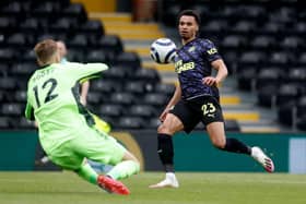 Newcastle United's English midfielder Jacob Murphy (R) shoots at goal in front of Fulham's Slovakian goalkeeper Marek Rodak (L) during the English Premier League football match between Fulham and Newcastle United at Craven Cottage in London on May 23, 2021.