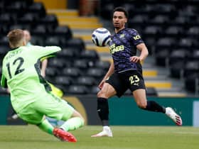 Newcastle United's English midfielder Jacob Murphy (R) shoots at goal in front of Fulham's Slovakian goalkeeper Marek Rodak (L) during the English Premier League football match between Fulham and Newcastle United at Craven Cottage in London on May 23, 2021.