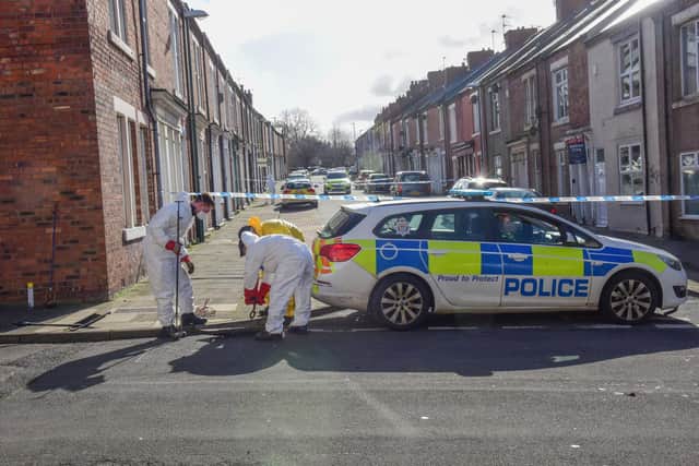 Police officers searching drains around Marshall Wallis Road, South Shields, on Saturday.