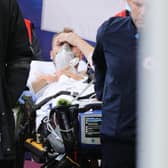 Christian Eriksen is taken to hospital after receiving CPR on the pitch.