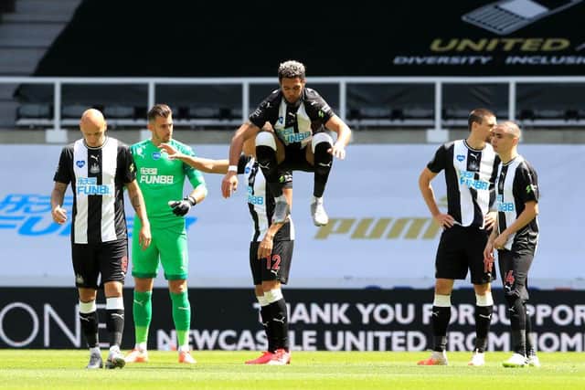 NEWCASTLE UPON TYNE, ENGLAND - JULY 05: Joelinton of Newcastle United warms up as the players enter the pitch prior to the Premier League match between Newcastle United and West Ham United at St. James Park on July 05, 2020 in Newcastle upon Tyne, England.