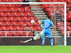 Gareth Evans scores the winning penalty for Bradford City