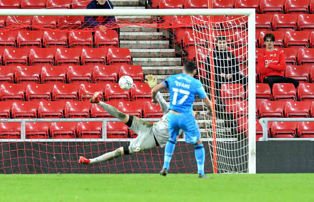 Gareth Evans scores the winning penalty for Bradford City