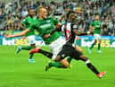 NEWCASTLE UPON TYNE, ENGLAND - SEPTEMBER 21: Christian Atsu of Newcastle is tackled by Dan Burn of Brighton during the Premier League match between Newcastle United and Brighton & Hove Albion at St. James Park on September 21, 2019 in Newcastle upon Tyne, United Kingdom. (Photo by Mark Runnacles/Getty Images)