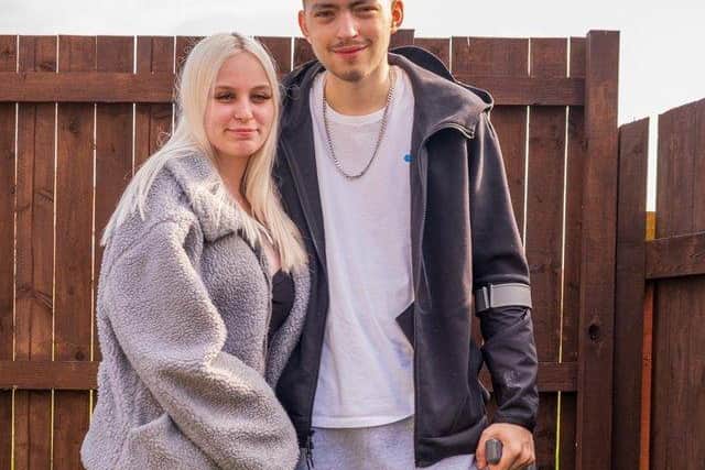 Kai Heslop at home with girlfriend Nicole Hughes. Photo by Steven Lomas.