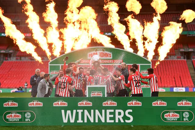 Sunderland players celebrate with the Papa John's Trophy after the Papa John's Trophy final.