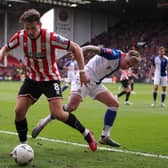 Sander Berge of Sheffield United battles for possession with Sammie Szmodics of Blackburn Rovers during the Emirates FA Cup Quarter Final match between Sheffield United and Blackburn Rovers at Bramall Lane on March 19, 2023 in Sheffield, England. (Photo by Naomi Baker/Getty Images)