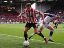 Sander Berge of Sheffield United battles for possession with Sammie Szmodics of Blackburn Rovers during the Emirates FA Cup Quarter Final match between Sheffield United and Blackburn Rovers at Bramall Lane on March 19, 2023 in Sheffield, England. (Photo by Naomi Baker/Getty Images)