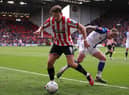 Sander Berge of Sheffield United battles for possession with Sammie Szmodics of Blackburn Rovers during the Emirates FA Cup Quarter Final match between Sheffield United and Blackburn Rovers at Bramall Lane on March 19, 2023 in Sheffield, England. (Photo by Naomi Baker/Getty Images)