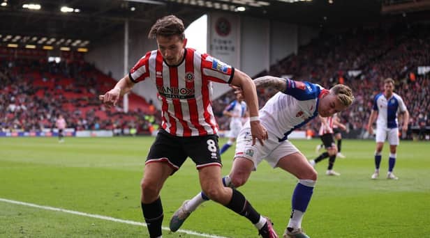 Sander Berge of Sheffield United battles for possession with Sammie Szmodics of Blackburn Rovers during the Emirates FA Cup Quarter Final match between Sheffield United and Blackburn Rovers at Bramall Lane on March 19, 2023 in Sheffield, England. (Photo by Naomi Baker/Getty Images)