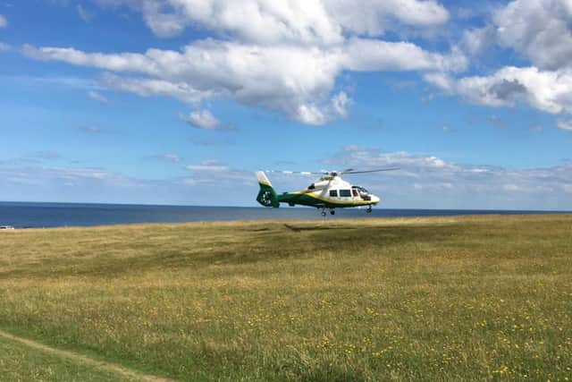 The Great North Air Ambulance on The Leas after reports a man had fallen from the cliffs.