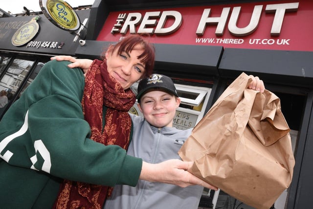 Gemma Larkin and 11-year-old Leo Gibson ,from Boldon, take home Good Friday fish and chips from The Red Hut cafe, Ocean Road