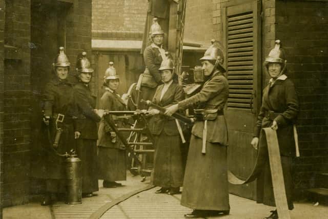 A sepia photograph of the Jarrow Ladies' Fire Brigade, 1916. The photo was taken in Back Wylam Street, Jarrow.