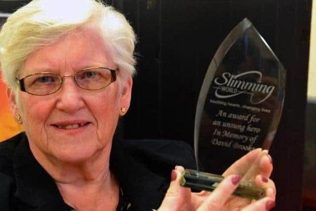 Lillian Drummond, a long-serving Slimming World consultant from Washington, with her 2019 This Unsung Hero award for services to Slimming World.