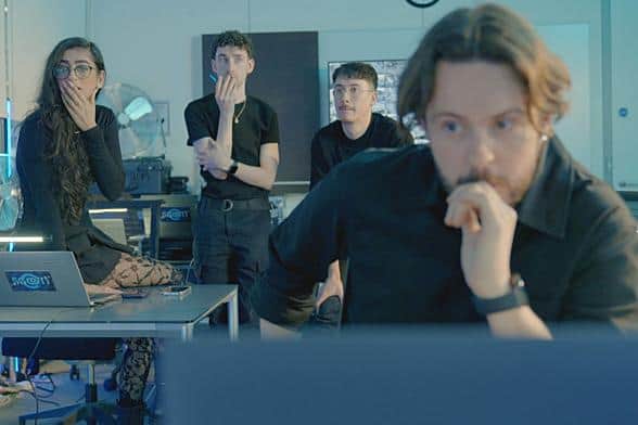 It all gets very tense in the Scam Interceptors HQ. The team are Harleen Nottay, Mark Lewis, Aaron Ng, and Nick Stapleton (Picture: BBC Studios)