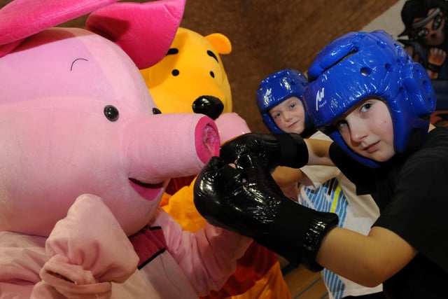 Piglet and Winnie the Pooh come face to face with Callum Lydon and Shane Elliott at a family day at Lukes Lane Community Centre. Remember this from 2011?
