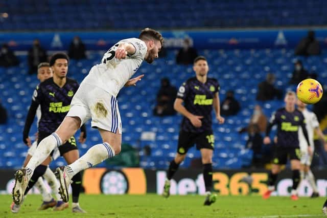 Leeds United's Northern Irish midfielder Stuart Dallas (L) heads home their third goal during the English Premier League football match between Leeds United and Newcastle United at Elland Road in Leeds, northern England on December 16, 2020. (Photo by Stu Forster / POOL / AFP) / RESTRICTED TO EDITORIAL USE. No use with unauthorized audio, video, data, fixture lists, club/league logos or 'live' services. Online in-match use limited to 120 images. An additional 40 images may be used in extra time. No video emulation. Social media in-match use limited to 120 images. An additional 40 images may be used in extra time. No use in betting publications, games or single club/league/player publications. /  (Photo by STU FORSTER/POOL/AFP via Getty Images)