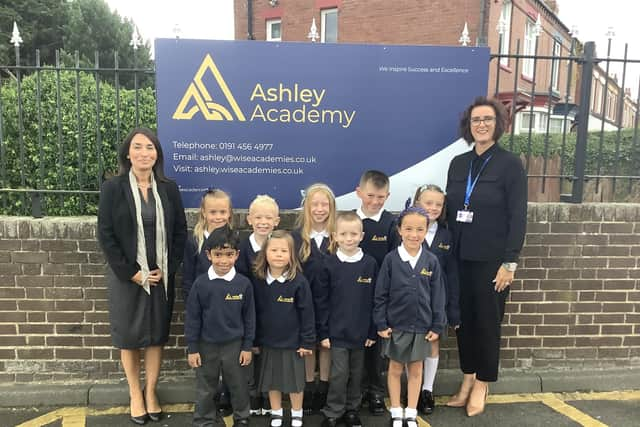 Zoe Carr, chief executive officer of WISE Academies (left) and Ashley Academy headteacher Denise Todd alongside children in their new school uniform.