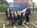 Zoe Carr, chief executive officer of WISE Academies (left) and Ashley Academy headteacher Denise Todd alongside children in their new school uniform.