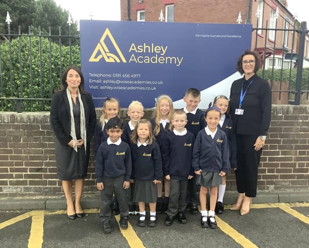 Zoe Carr, chief executive officer of WISE Academies (left) and Ashley Academy headteacher Denise Todd alongside children in their new school uniform.