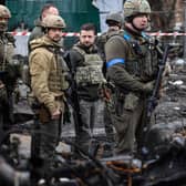 President Volodymyr Zelensky walks in the town of Bucha, just northwest of the Ukrainian capital Kyiv on April 4, 2022. President Zelensky has said  the Russian leadership was responsible for civilian killings in Bucha, outside Kyiv, where bodies were found lying in the street after the town was retaken by the Ukrainian army. (Photo by RONALDO SCHEMIDT / AFP) (Photo by RONALDO SCHEMIDT/AFP via Getty Images)