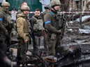President Volodymyr Zelensky walks in the town of Bucha, just northwest of the Ukrainian capital Kyiv on April 4, 2022. President Zelensky has said  the Russian leadership was responsible for civilian killings in Bucha, outside Kyiv, where bodies were found lying in the street after the town was retaken by the Ukrainian army. (Photo by RONALDO SCHEMIDT / AFP) (Photo by RONALDO SCHEMIDT/AFP via Getty Images)