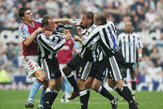 Lee Bowyer and Kieron Dyer of Newcastle come to blows during the FA Barclays Premiership match between Newcastle United and Aston Villa at St James Park on April 2, 2005 in Newcastle, England.  (Photo by Laurence Griffiths/Getty Images)