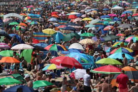 Crowds gather on the beach in Bournemouth as Thursday could be the UK's hottest day of the year with scorching temperatures forecast to rise even further. Picture: PA WIRE