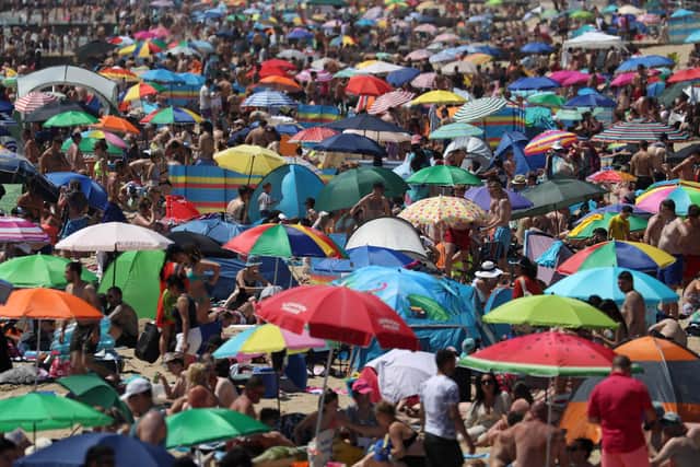 Crowds gather on the beach in Bournemouth as Thursday could be the UK's hottest day of the year with scorching temperatures forecast to rise even further. Picture: PA WIRE