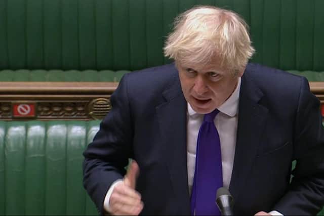 Prime Minister Boris Johnson speaks during Prime Minister's Questions in the House of Commons today.