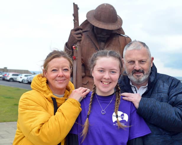 Heart transplant youngster Kayleigh Llewellyn with parents Shaun and Sonia Llewellyn.