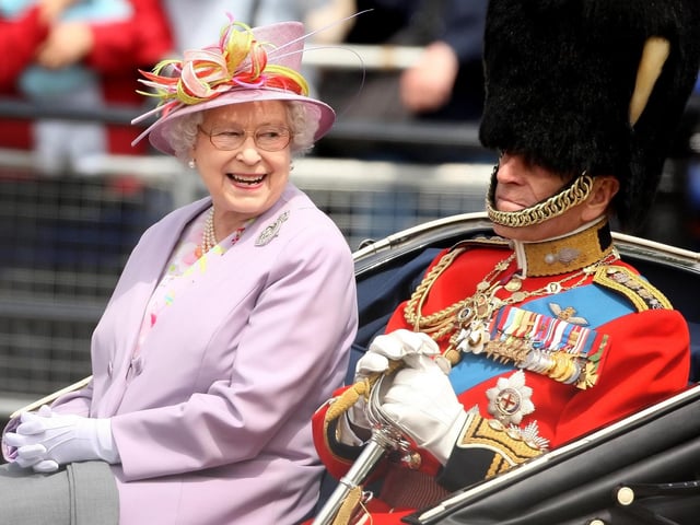 Queen Elizabeth II and the Duke of Edinburgh return to Buckingham Palace by carriage following the Trooping the Colour ceremony at Horse Guards Parade. 12/06/10