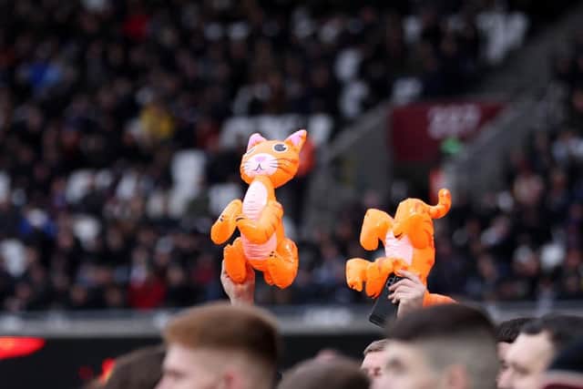 Newcastle United fans hold inflatable cats in the crowd during the Premier League match between West Ham United and Newcastle United at London Stadium on February 19, 2022 in London, England. (Photo by Warren Little/Getty Images)
