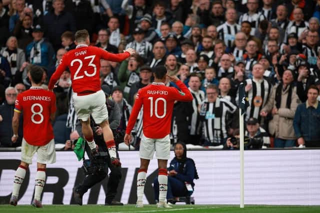 Marcus Rashford of Manchester United celebrates after scoring the team's second goal during the Carabao Cup Final match between Manchester United and Newcastle United at Wembley Stadium on February 26, 2023 in London, England. (Photo by Eddie Keogh/Getty Images)