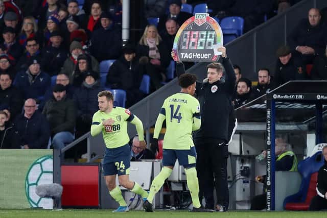 LONDON, ENGLAND - DECEMBER 03: Ryan Fraser of AFC Bournemouth comes on for Arnaut Danjuma of AFC Bournemouth as the fourth official holds up a Rainbow lace campaign inspired board during the Premier League match between Crystal Palace and AFC Bournemouth  at Selhurst Park on December 03, 2019 in London, United Kingdom. (Photo by Jack Thomas/Getty Images)