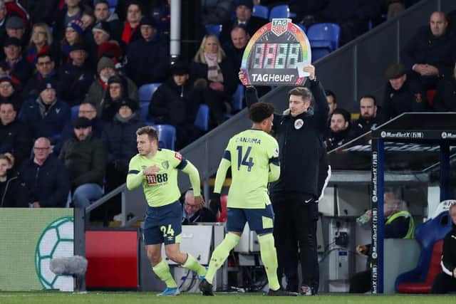 LONDON, ENGLAND - DECEMBER 03: Ryan Fraser of AFC Bournemouth comes on for Arnaut Danjuma of AFC Bournemouth as the fourth official holds up a Rainbow lace campaign inspired board during the Premier League match between Crystal Palace and AFC Bournemouth at Selhurst Park on December 03, 2019 in London, United Kingdom. (Photo by Jack Thomas/Getty Images)