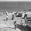 Beachgoers enjoying a summers day in Whitburn Beach in May 1979 in their 70s attire and even bringing their cars onto the beach. 