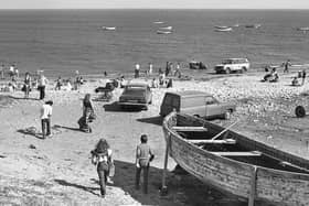Beachgoers enjoying a summers day in Whitburn Beach in May 1979 in their 70s attire and even bringing their cars onto the beach. 