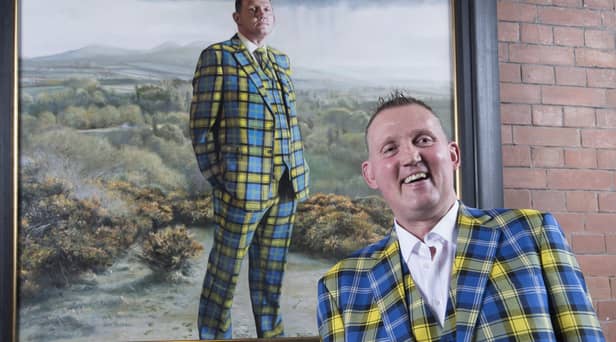 Doddie Weir with his painting in the Scottish National Portrait Gallery (SNPG)