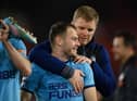 Ryan Fraser of Newcastle United is embraced by Eddie Howe, Head Coach of Newcastle United, after the final whistle of Premier League match between Southampton and Newcastle United at St Mary's Stadium on March 10, 2022 in Southampton, England.  (Photo by Mike Hewitt/Getty Images)