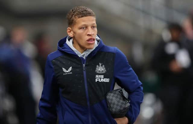 Dwight Gayle of Newcastle United looks on as he arrives at the stadium prior to the Premier League match between Newcastle United and Norwich City at St. James Park on November 30, 2021 in Newcastle upon Tyne, England. (Photo by Ian MacNicol/Getty Images)