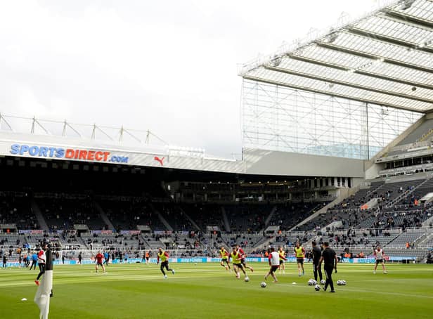 NEWCASTLE UPON TYNE, ENGLAND - MAY 19: A general view inside the stadium as both teams warm up prior to the Premier League match between Newcastle United and Sheffield United at St. James Park on May 19, 2021 in Newcastle upon Tyne, England.A limited number of fans will be allowed into Premier League stadiums as Coronavirus restrictions begin to ease in the UK following the COVID-19 pandemic. (Photo by Owen Humphreys - Pool/Getty Images)