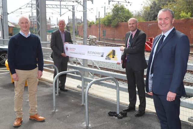 Martin Kearney, chief operating officer at Nexus, and Rob Harwood, Rail Contracts Director at Buckingham Group, sign the contract for Metro Flow project.