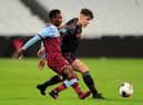 Amadou Diallo of West Ham United is tackled by Thomas Sparrow of Stoke City during the Premier League 2 match between West Ham United U23 and Stoke City U23 at London Stadium on February 17, 2020 in London, England. (Photo by Alex Burstow/Getty Images)
