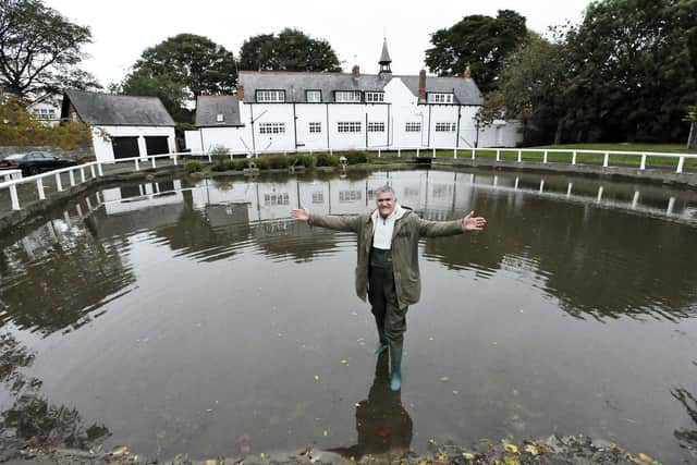 Gary Johnston standing in the recently dredged Whitburn Pond.
Picture by FRANK REID