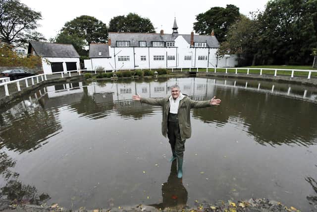 Gary Johnston standing in the recently dredged Whitburn Pond. 

Picture by FRANK REID