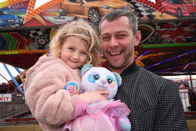 Graeme Halling and four-year-old Sophie Halling from Harton enjoy Good Friday at the fair